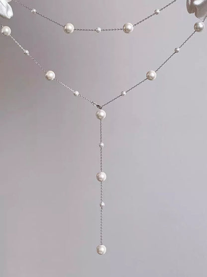 Starry Pearl Choker Necklace in gold and silver options, featuring imitation pearls and electroplated finish.