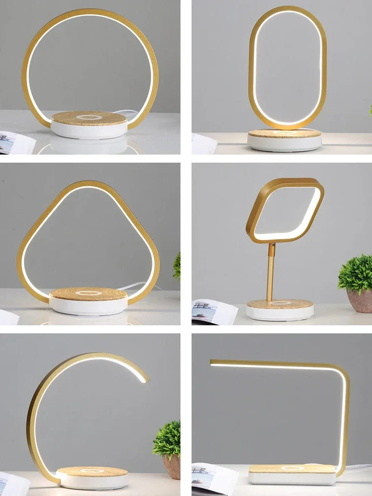 Modern bedside lamp with wireless charging pad and adjustable LED lighting in gold finish