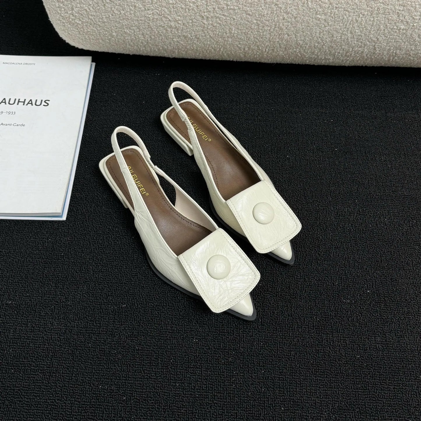 Women's low-heel pointed toe sandals with a back strap in black, brown, apricot, and silver colours.