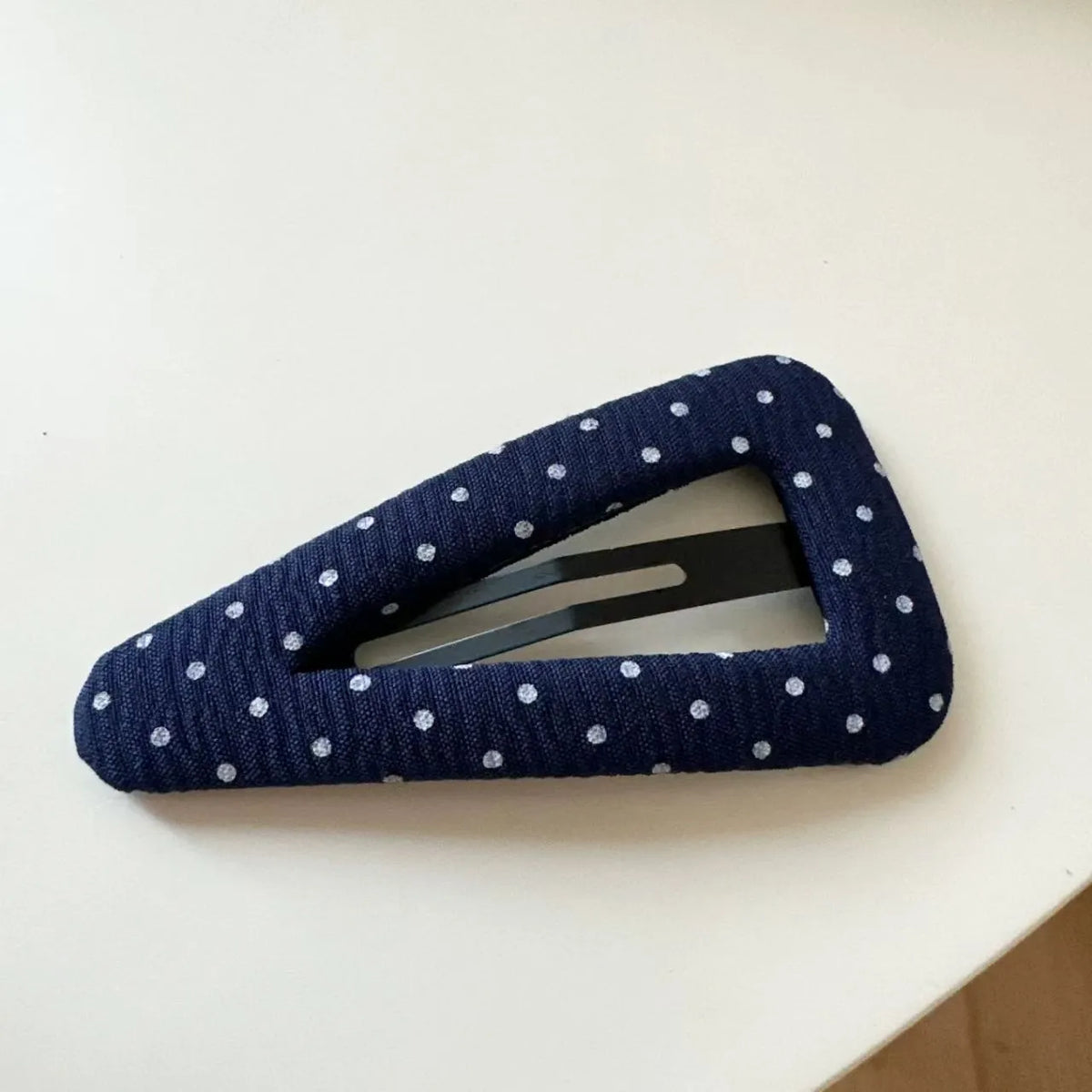French retro dot pattern barrettes in triangle and water drop shapes with dark denim styling