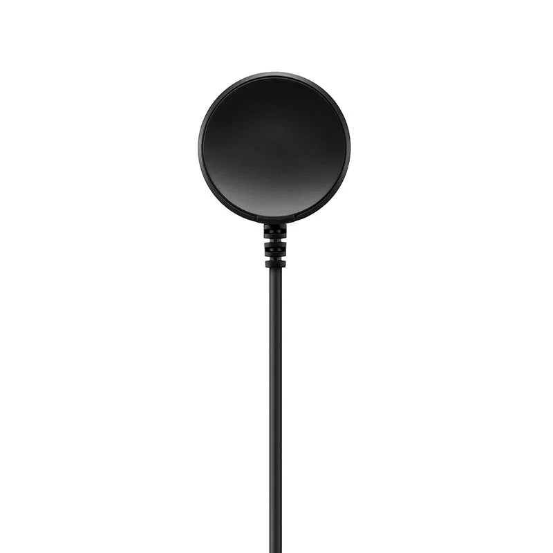 Black plastic USB wireless charging dock for smartwatches on a flat surface.