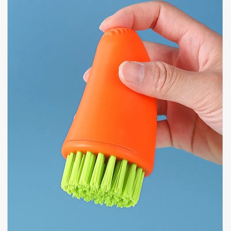 Carrot-shaped kitchen cleaning brush with nylon bristles in orange colour