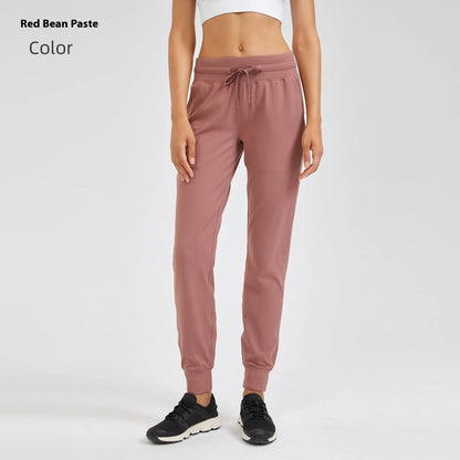 Women's high waist yoga pants with drawstring waistband in Belgian blue colour, showing stretch fabric during yoga pose