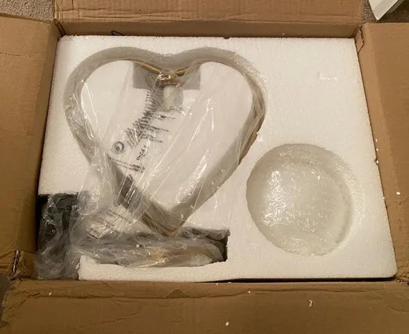 Heart-shaped lamp with touch control, 15cm diameter, and adjustable brightness settings on a table