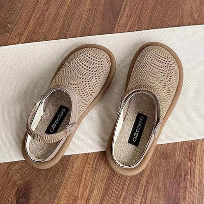 Women's beige linen slip-on shoes with mesh lining and a soft rubber sole.