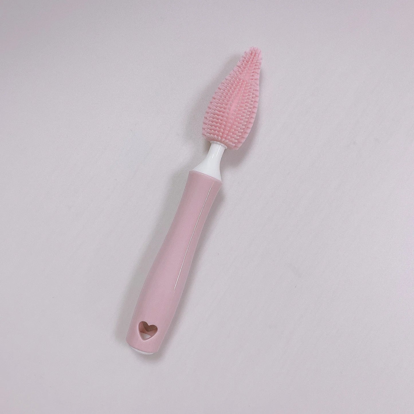 Silicone baby bottle brush with flexible handle and straw cleaning attachment in multiple colour options