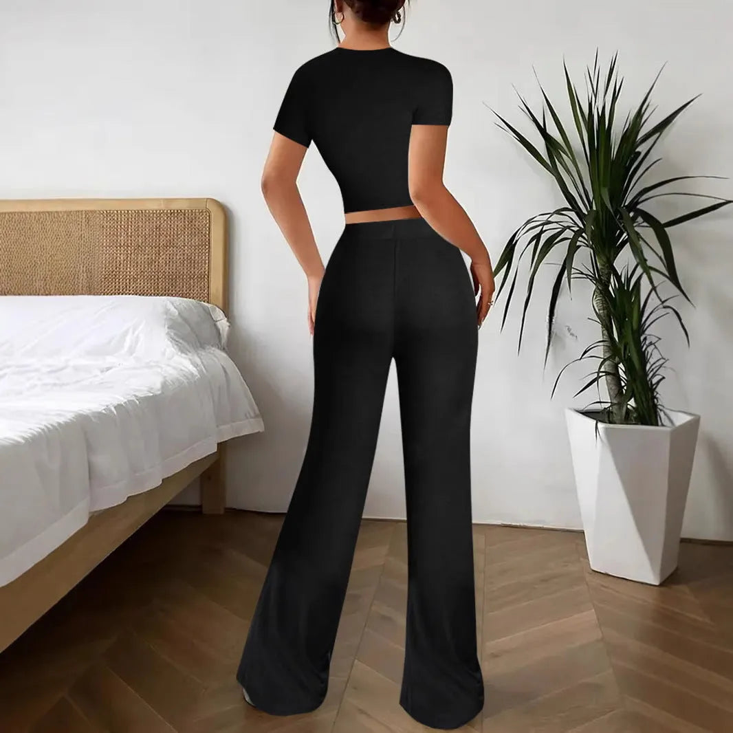 Black high waist trousers and regular sleeve t-shirt suit set on a model, showing the coordinated two-piece outfit