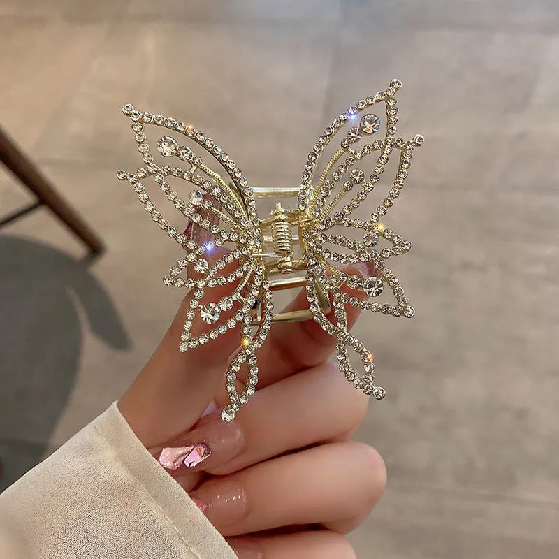Butterfly-shaped alloy hair clip for women, available in rhinestone or pearl style.