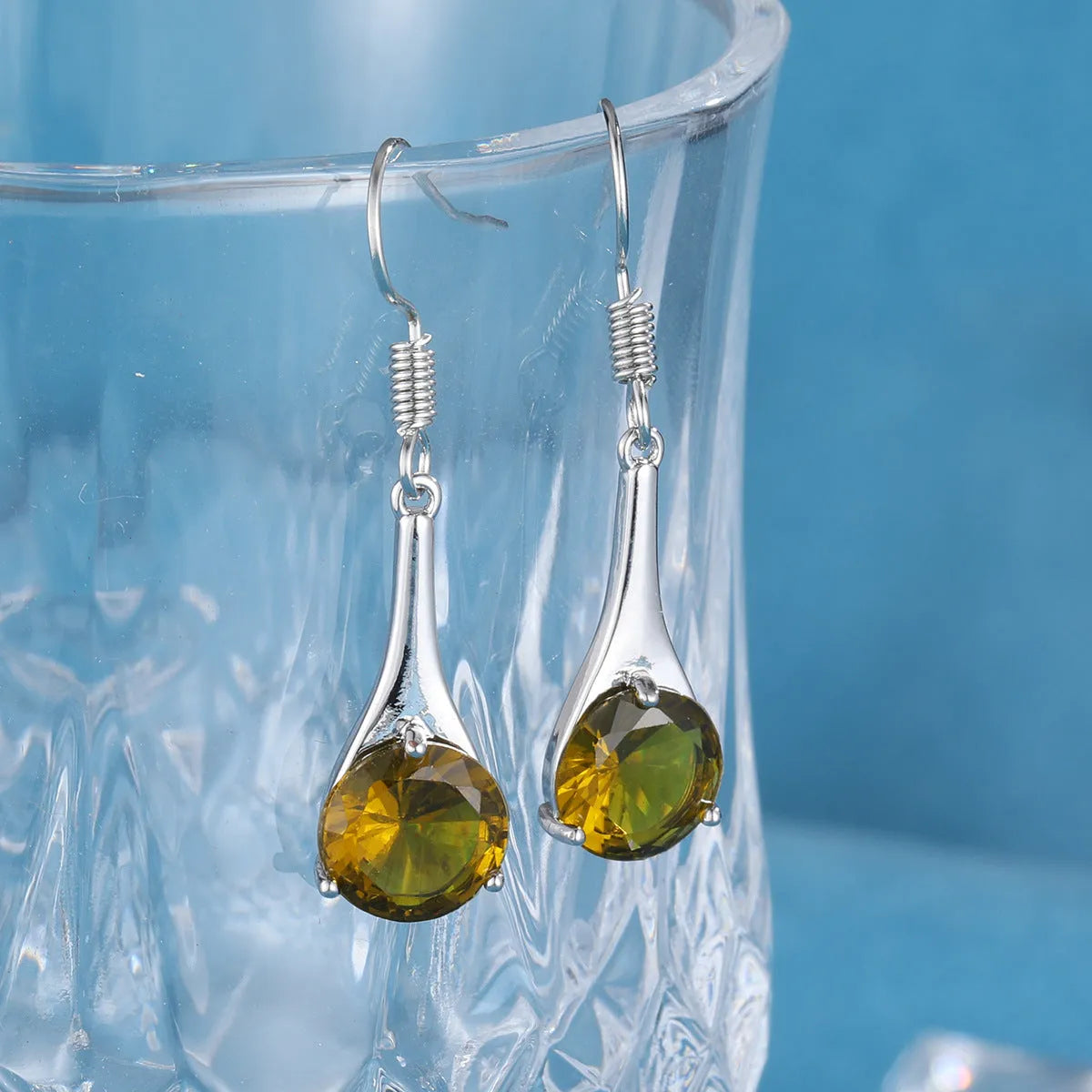 Olive green topaz earrings with water drop shape measuring 2.5 cm, electroplated alloy construction