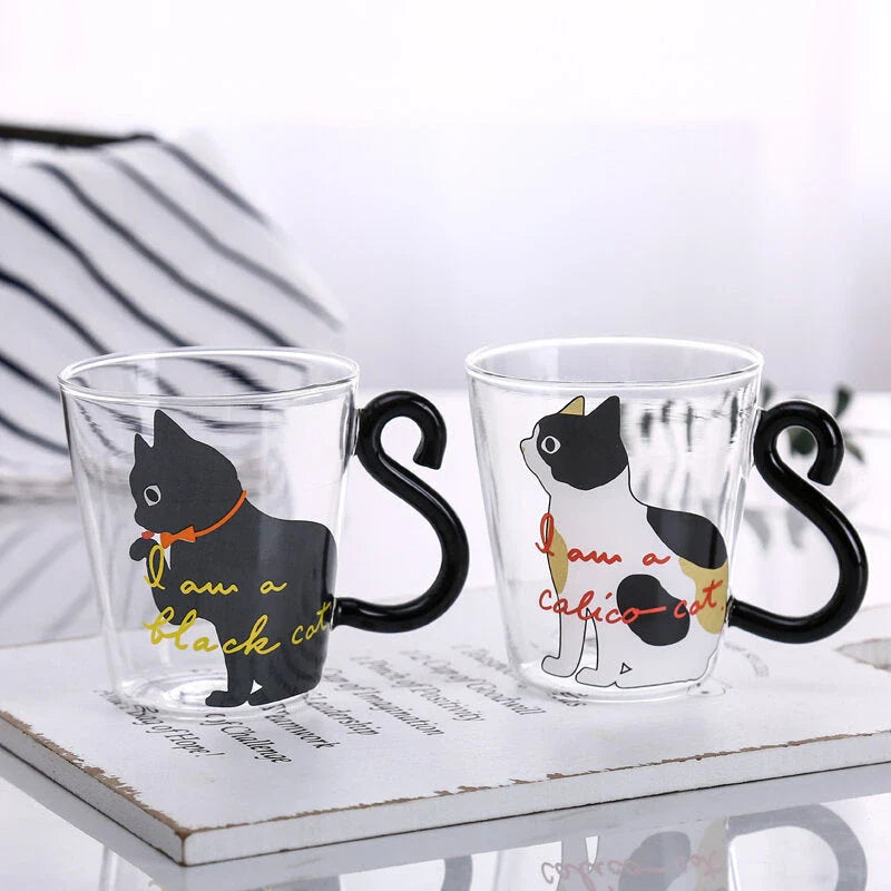 Adorable cat-shaped glass mug in black and white colors, perfect for coffee, tea, or juice
