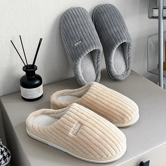 Cozy cotton slippers in various colors, featuring a soft, plush lining and non-slip rubber sole for indoor comfort and warmth