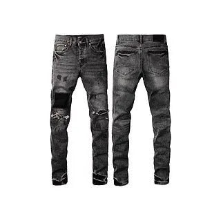 A pair of black men's slim-fit skinny jeans with a straight-leg pencil pants silhouette on a mannequin.