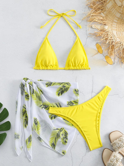 Women's orange three-piece bikini swimsuit with a matching printed gauze skirt laid flat.