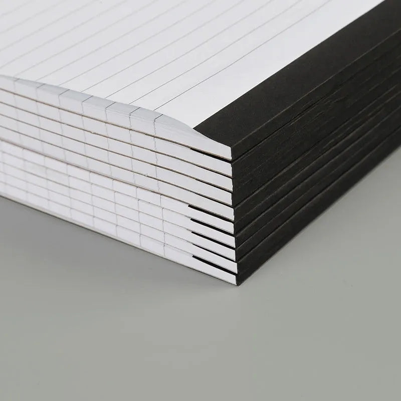 A4 tearable notebook with grid-lined pages and wireless adhesive binding for clean page removal