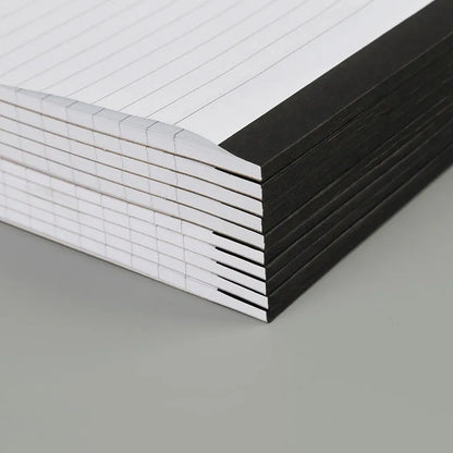 A4 tearable notebook with grid-lined pages and wireless adhesive binding for clean page removal