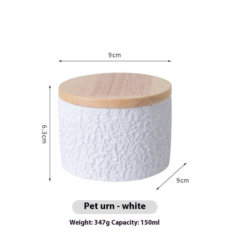 Handmade cement cinerary casket for pet ashes in six colours: black, grey, green, pink, white, yellow