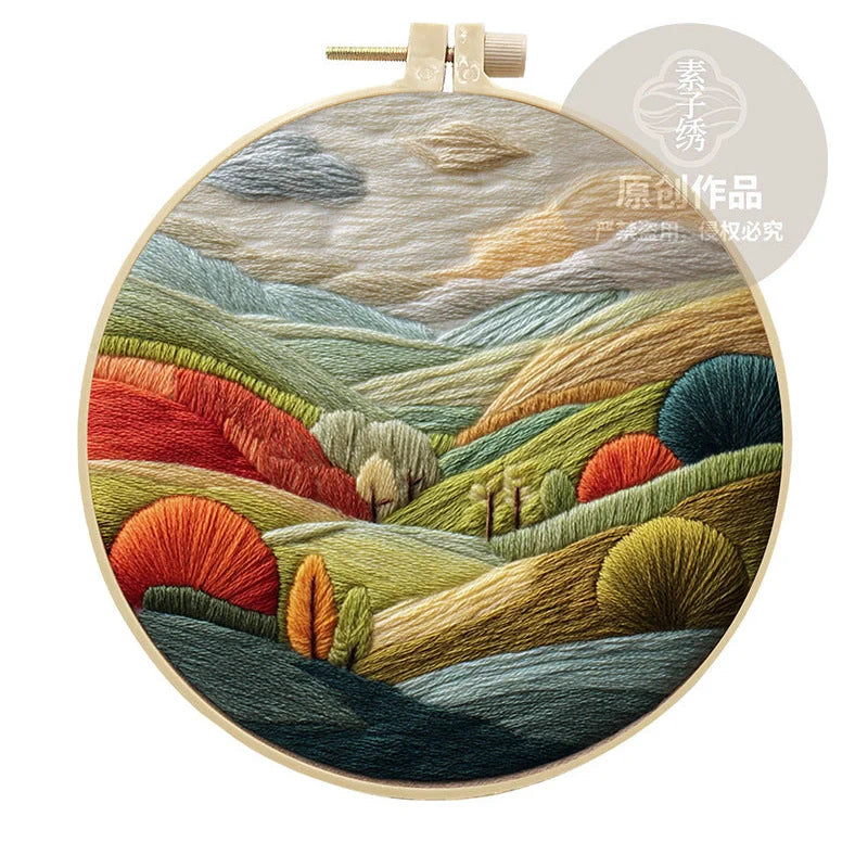 Embroidery DIY landscape kit with bamboo frame, printed fabric, thread, and needles for textile art