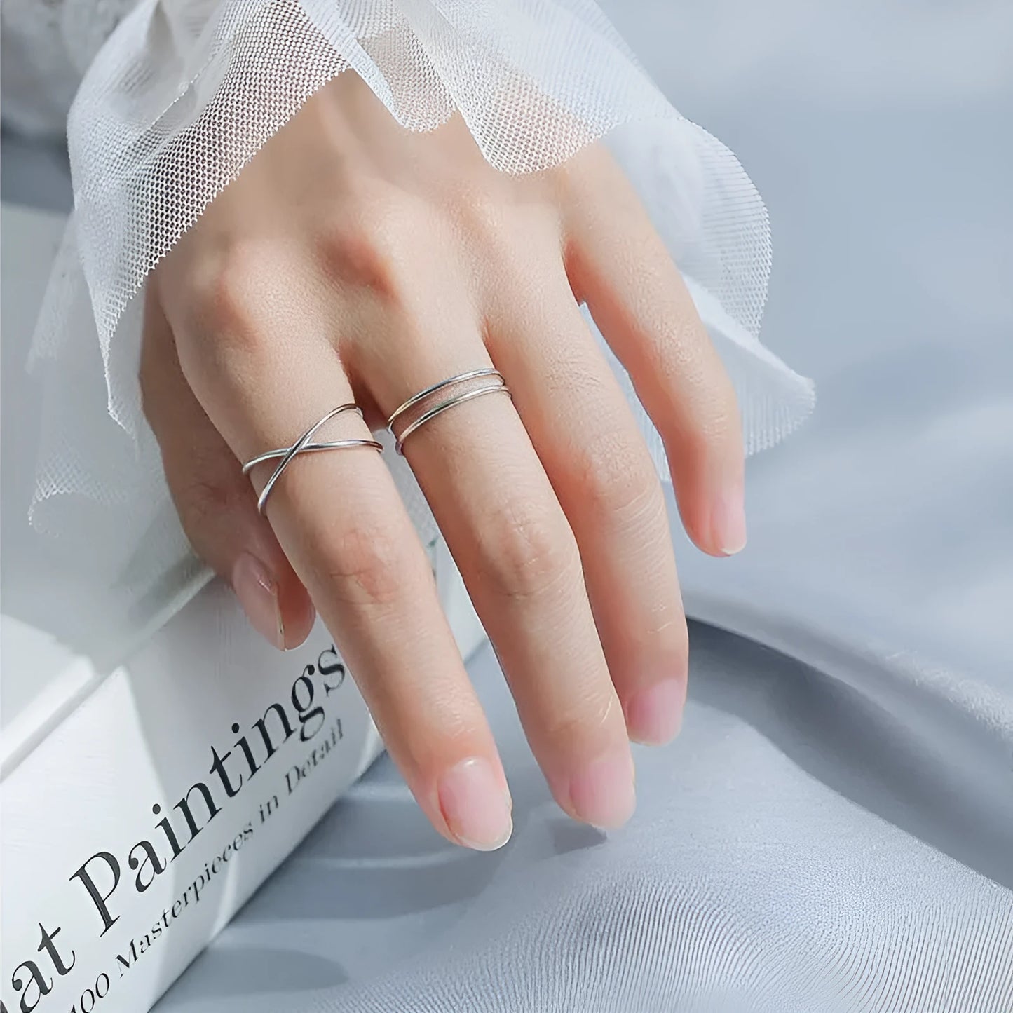 Adjustable silver plated geometric cross ring for women in gold tone or silver tone on a copper base.