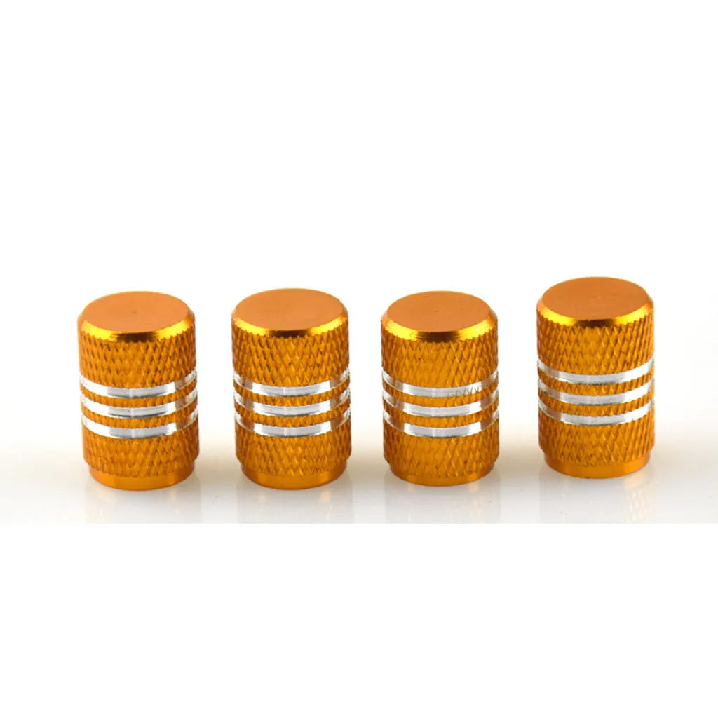 Set of stainless steel car tyre valve caps in multiple colours including black, red, blue, and gold.