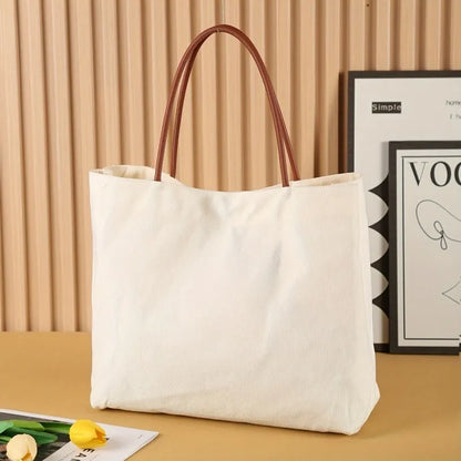 Natural cotton canvas tote bag with strong handles in beige white colour