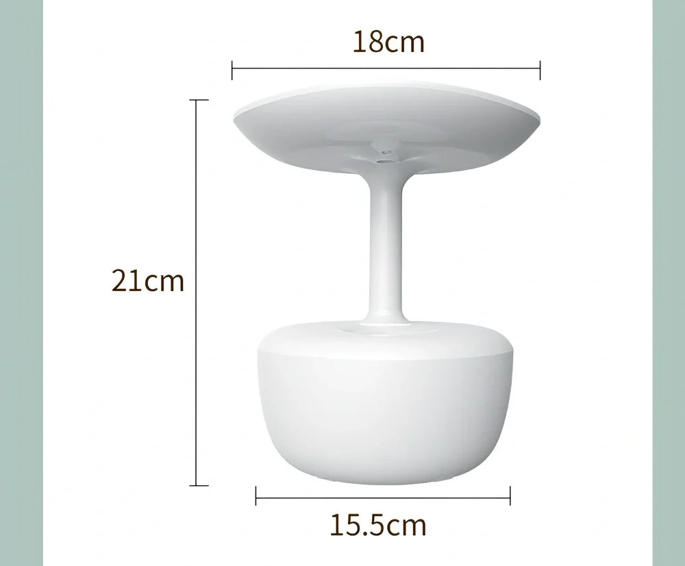 White lotus leaf shaped USB humidifier with mist output and LED illumination on wooden surface