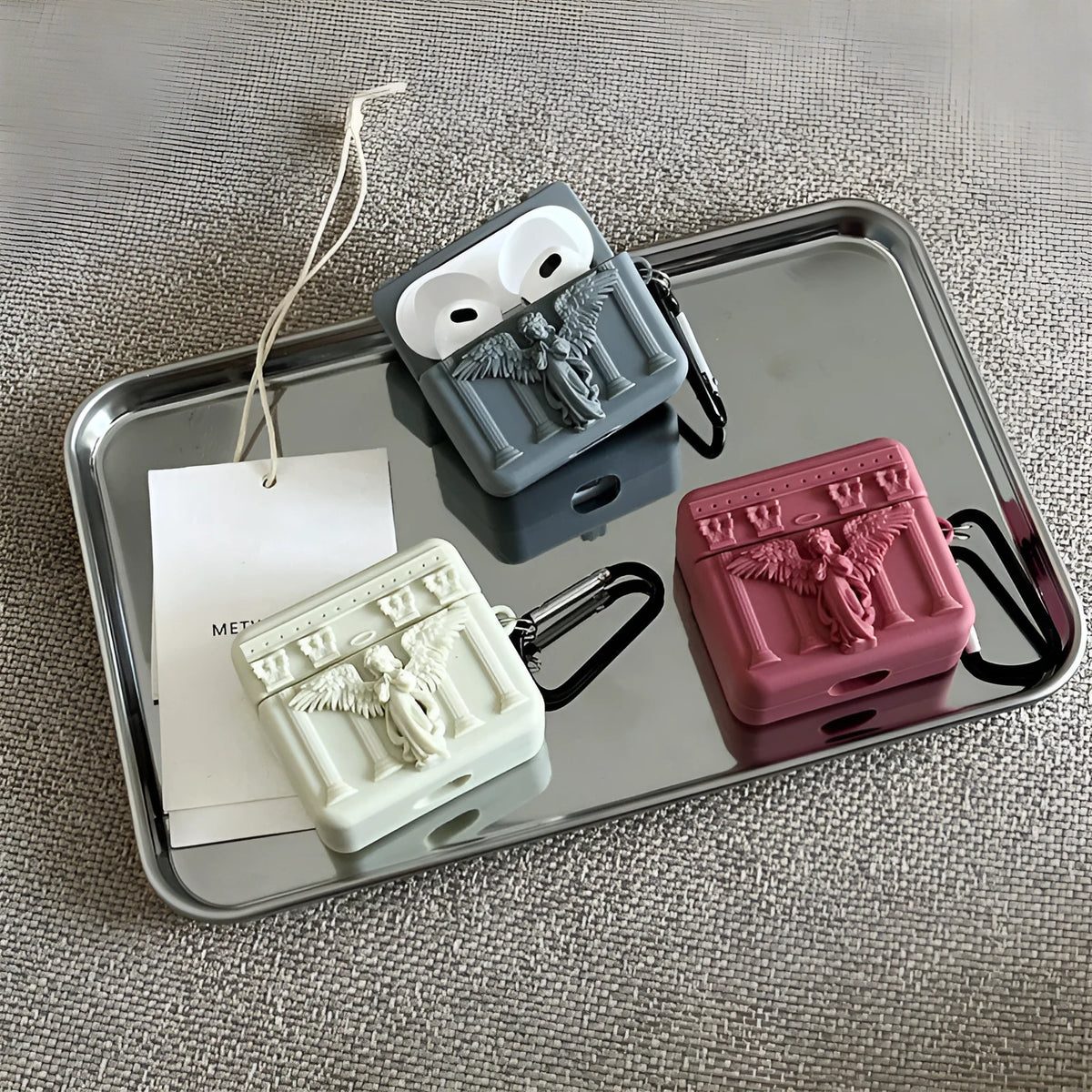 Silicone earphone case for Apple AirPods in white, grey, or red with 3D Angel design