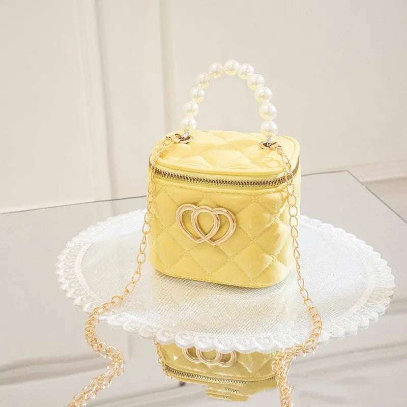 PVC bucket-style gel bag with a heart-shaped pattern, shown in apricot colour.