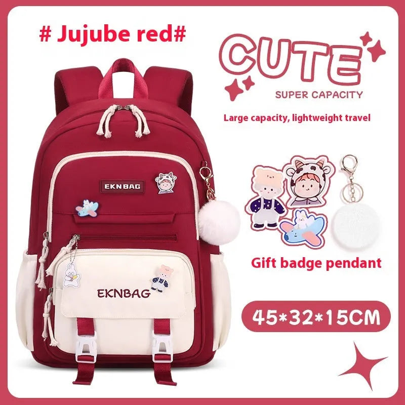 Pink waterproof Oxford cloth school backpack for girls with curved shoulder straps, shown with matching pencil case.