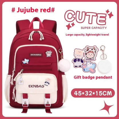 Pink waterproof Oxford cloth school backpack for girls with curved shoulder straps, shown with matching pencil case.