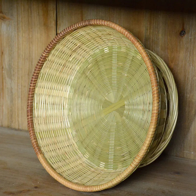 Handmade bamboo storage basket with woven design in 26x8cm, 25x9cm, and 24x12cm sizes on a wooden table
