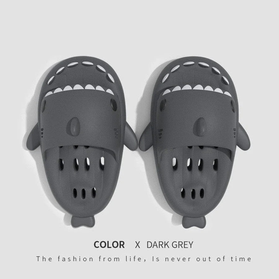 Colorful shark-themed shower slides with drainage holes, designed for comfortable and practical use in the pool or shower.