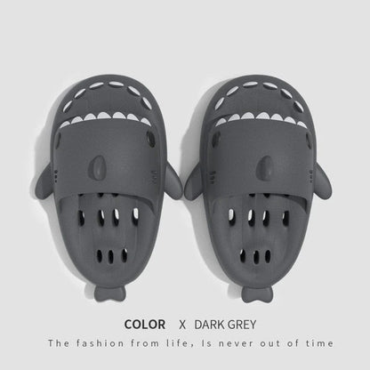 Colorful shark-themed shower slides with drainage holes, designed for comfortable and practical use in the pool or shower.