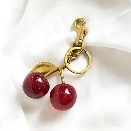 Zinc alloy key ring pendant charm in red or pink with three-dimensional design.