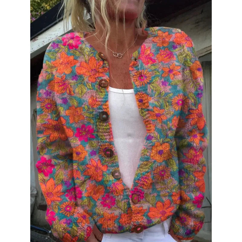 Yellow women's cardigan coat with a raised 3D digital print pattern, shown on a hanger.