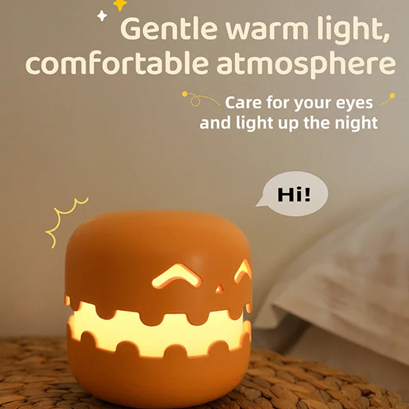 Pumpkin-shaped nightlight with soft silicone construction and warm, soothing glow for creating a cozy Halloween atmosphere