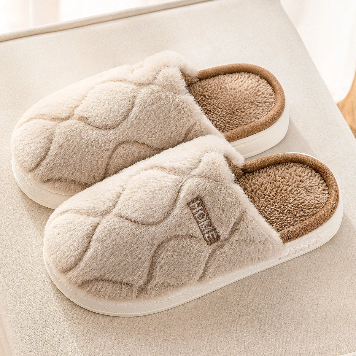 Cozy plush slippers in various colors, including light gray, khaki, yellow, and pink, with a soft plush upper and durable PVC sole for indoor and outdoor use.