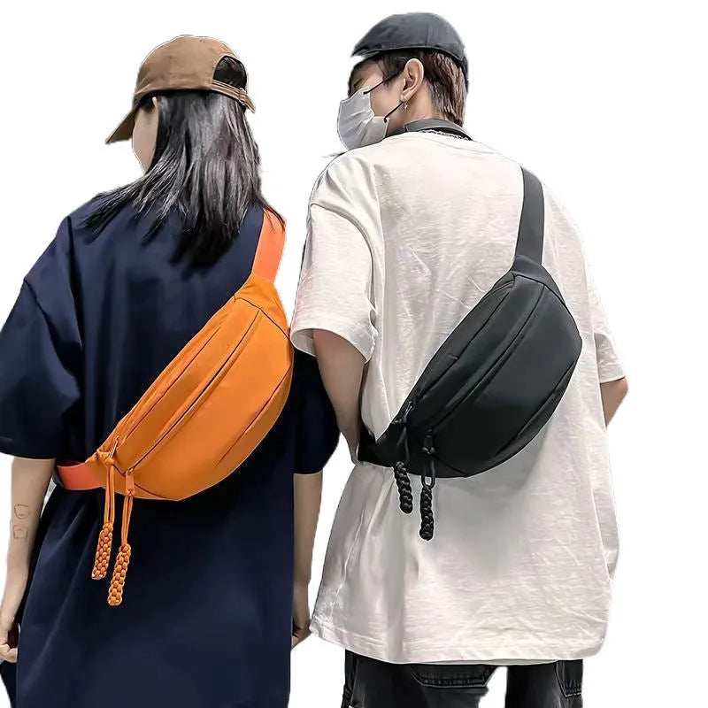 Men's polyester crossbody bag in black colour showing shoulder strap and front compartment