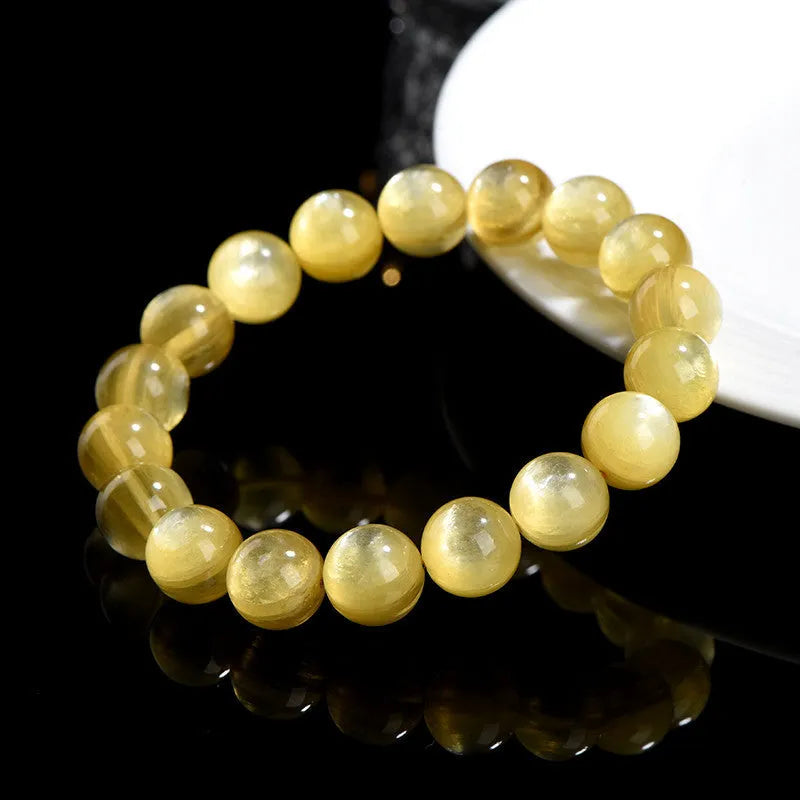 Yellow golden dragon mica round beads bracelet with polished lepidolite gemstones.