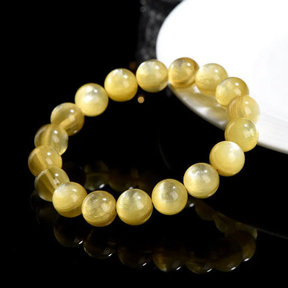 Yellow golden dragon mica round beads bracelet with polished lepidolite gemstones.