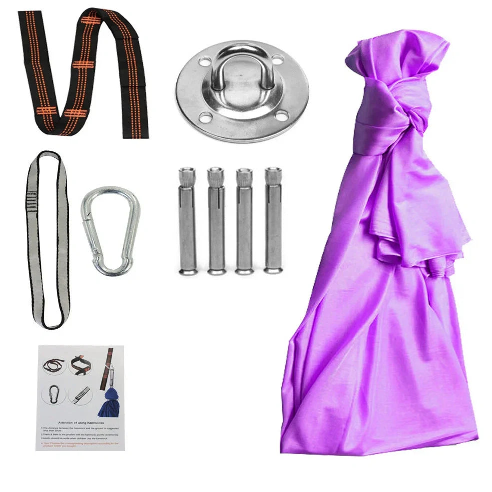 Child in black therapy swing cocoon with multi-loop daisy chain height adjustment system