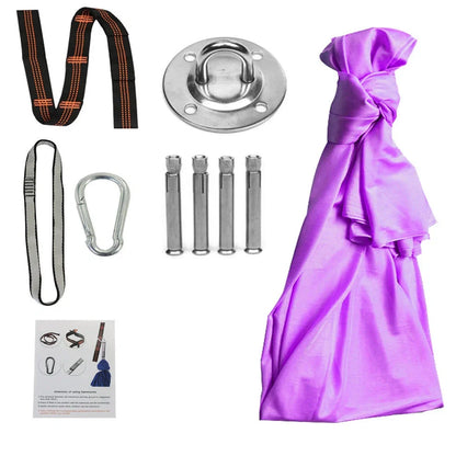 Child in black therapy swing cocoon with multi-loop daisy chain height adjustment system