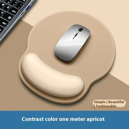 Silicone mouse mat with wristband in a gradient blue black colour pattern on a desk.
