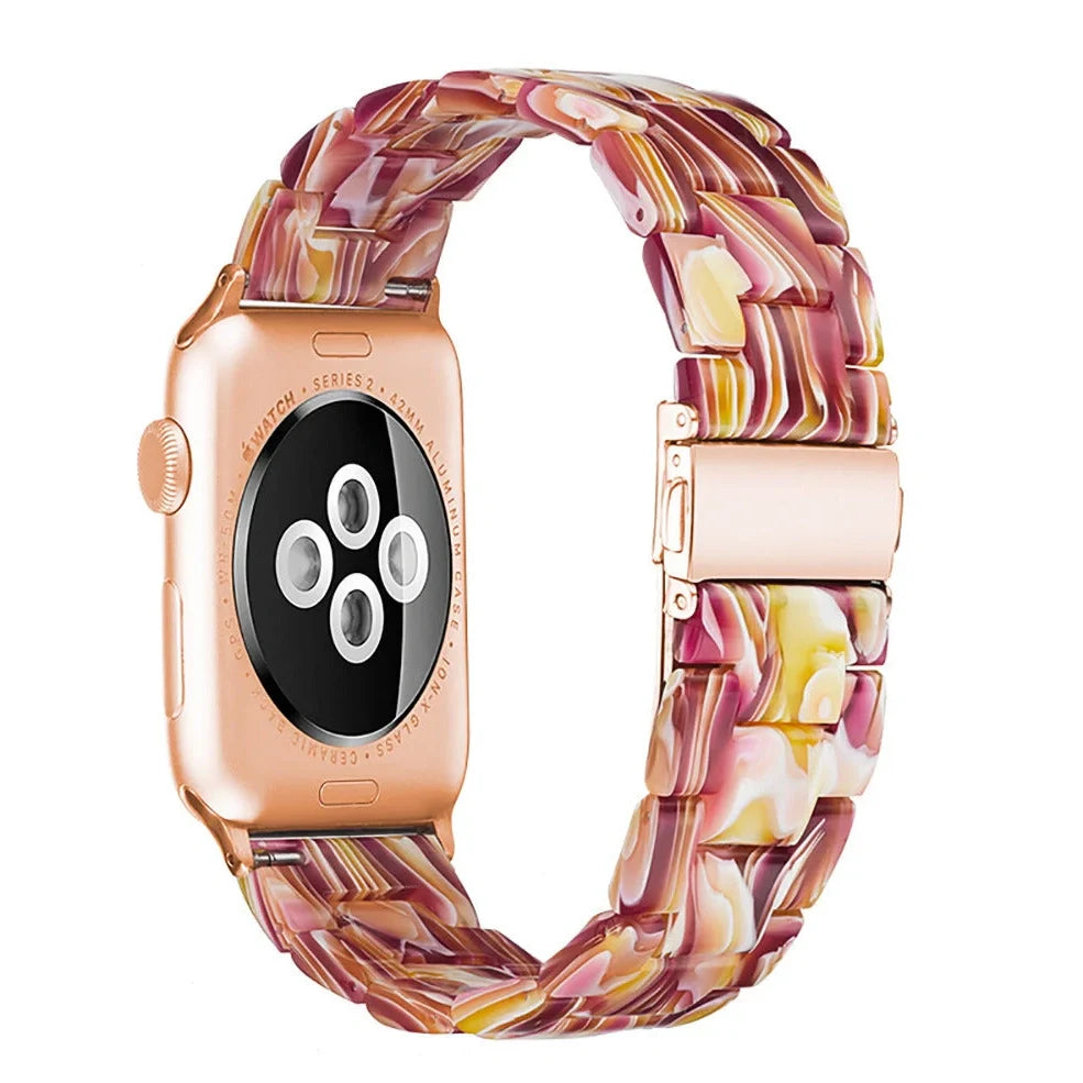 Slim resin Apple Watch strap showing attachment mechanism and colour options