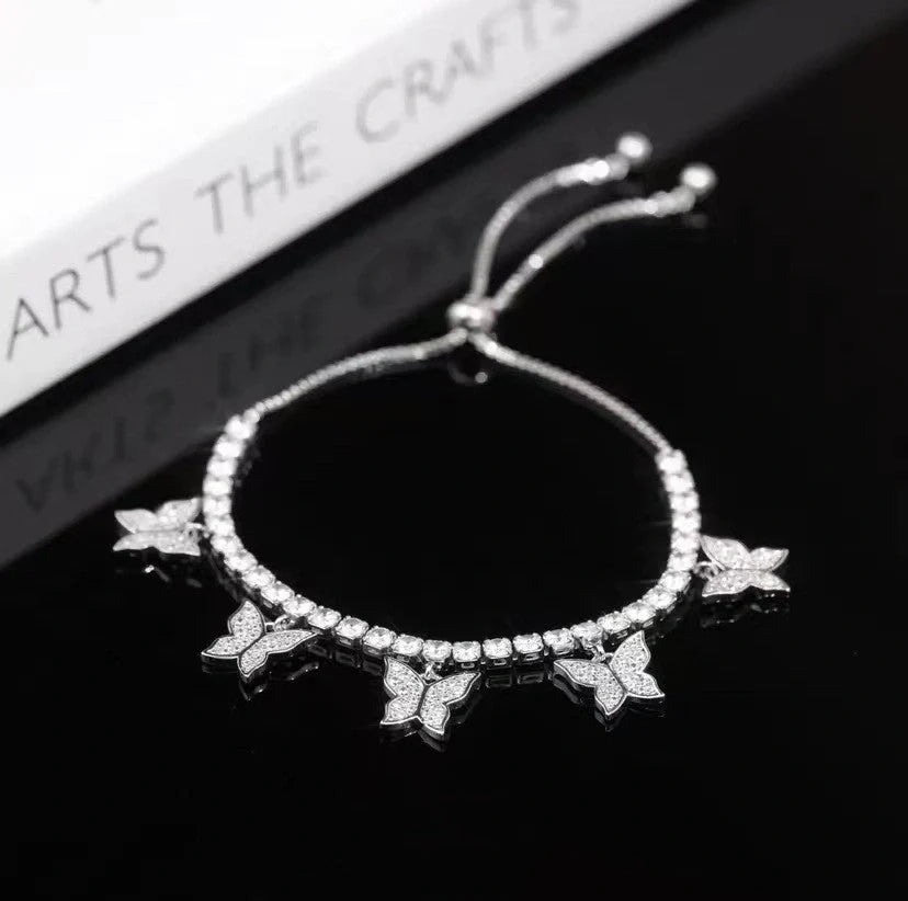Elegant copper bracelet with delicate butterfly motifs and sparkling zircon accents