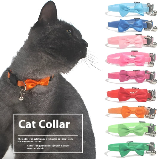 Striped nylon cat collar with decorative bow and bell in multiple colour options on a white background.
