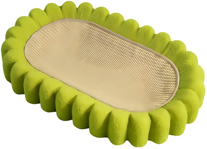 Green oval-shaped sisal cat scratching pad with a central bowl, serving as a cat bed and furniture protector.