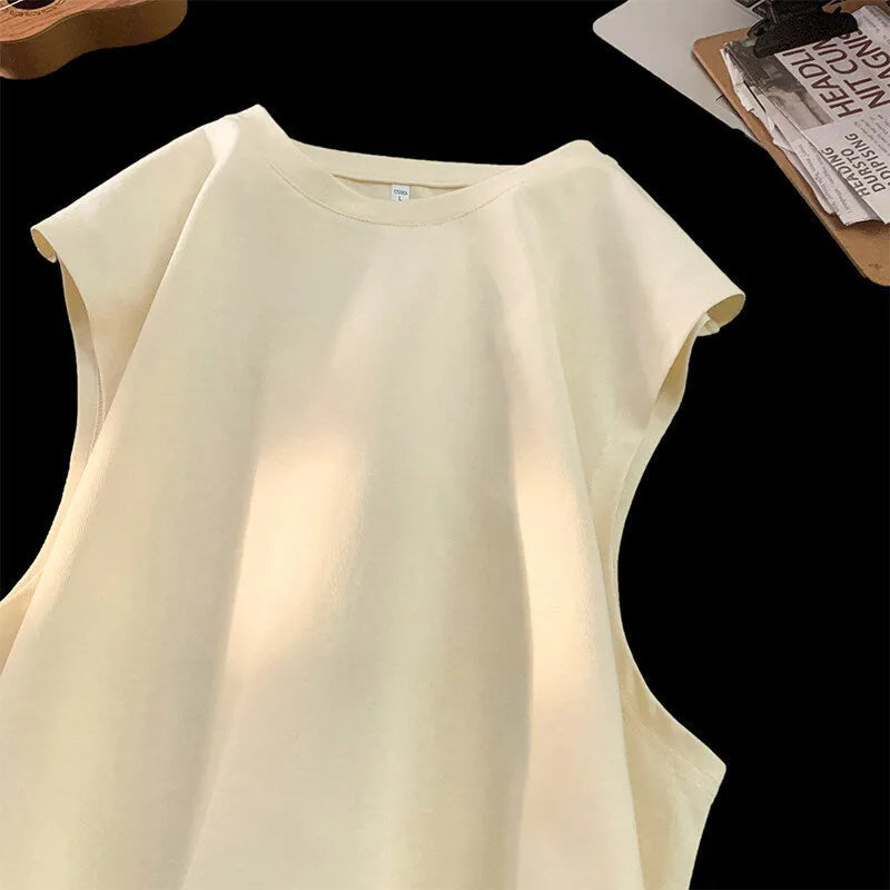 Men's loose solid colour cotton sleeveless tank top on a hanger.