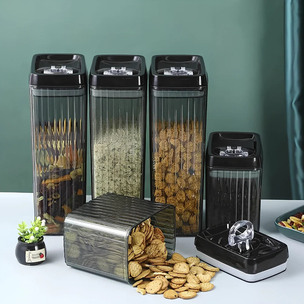 Six black food storage containers with lids in two sizes: two large 3.3-litre and four smaller 1.5-litre jars