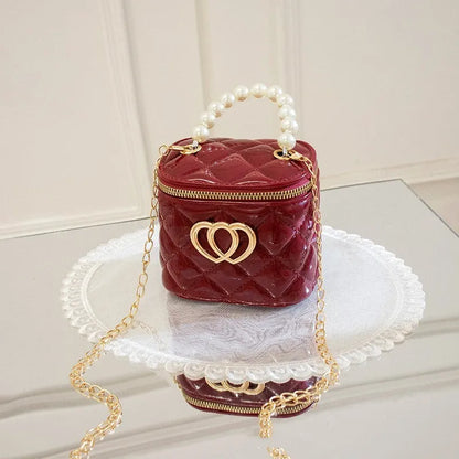 PVC bucket-style gel bag with a heart-shaped pattern, shown in apricot colour.