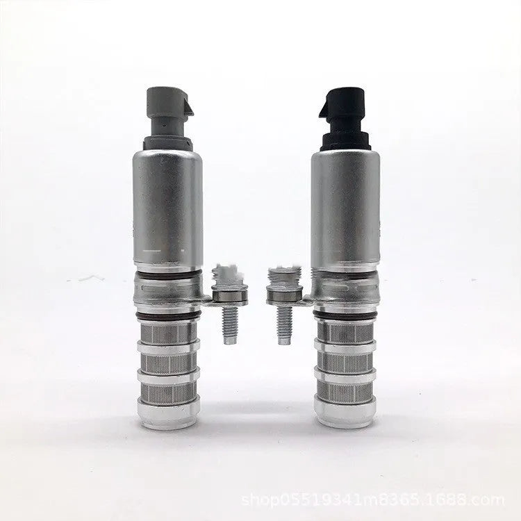 A pair of silver automotive VVT oil control solenoid valves for Buick and Chevrolet models.